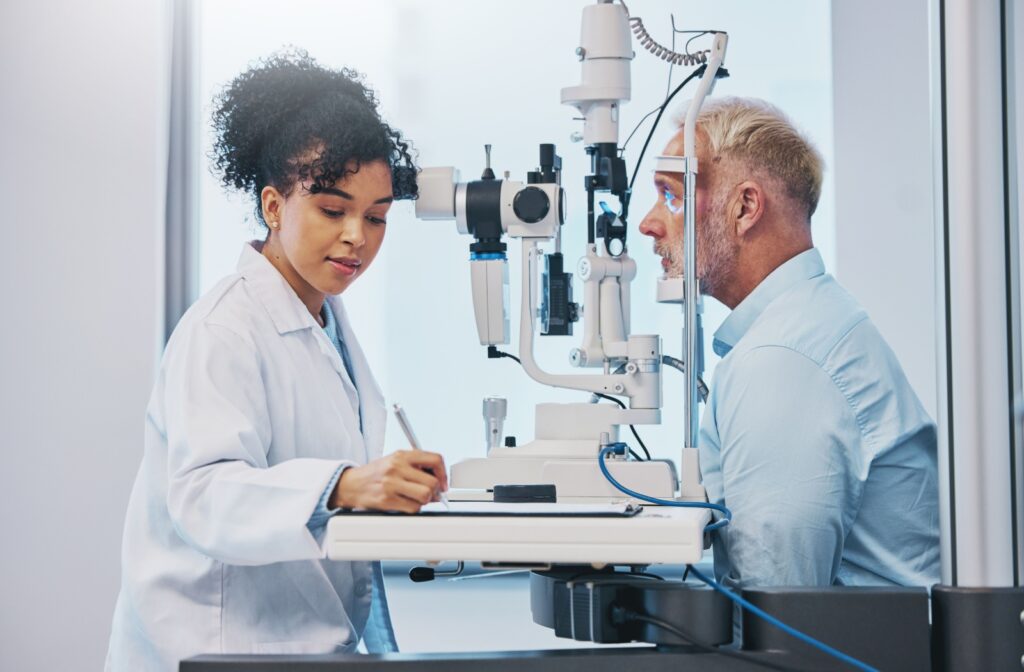 A person getting their vision checked by an optometrist.