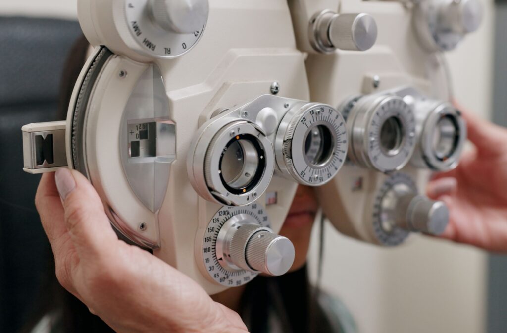 A phoropter being used during an eye exam to determine the correct prescription for someone with myopia.